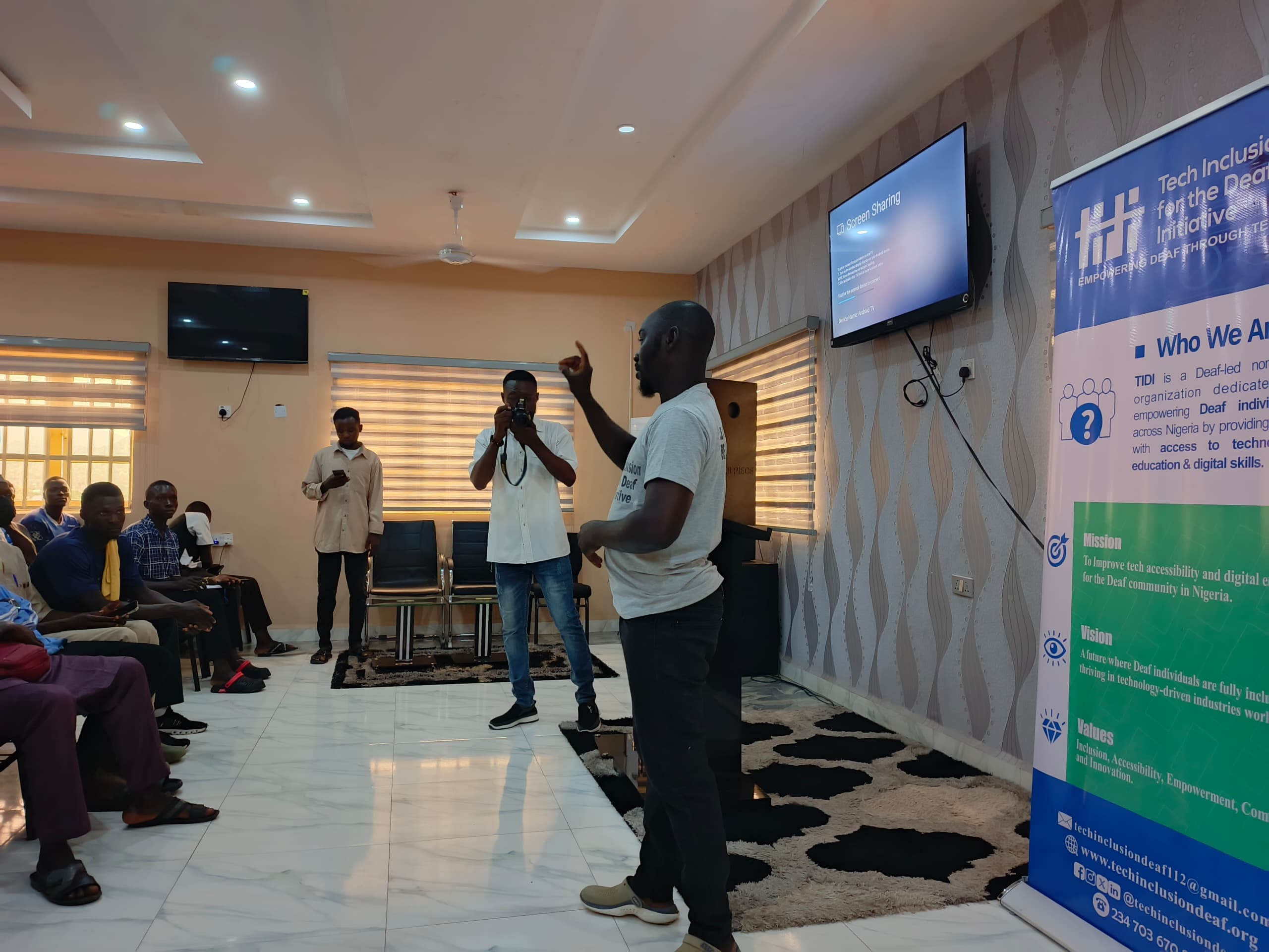 Deaf youth learning with a mentor — dark cinematic background