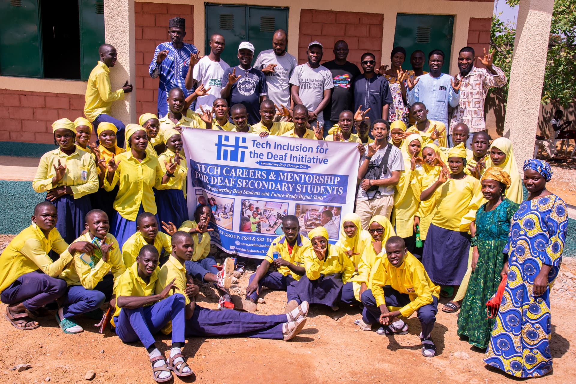 Teacher showing laptop to student